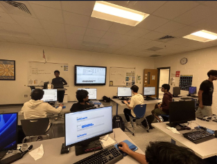 Students collaborating in a computer classroom
